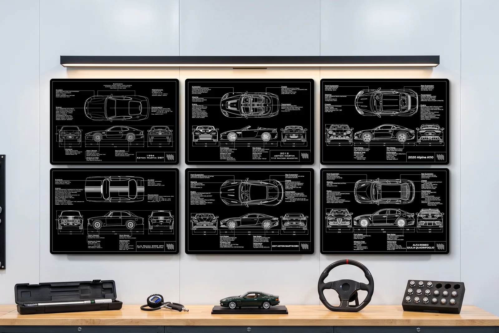 2012 Aston Martin V12 Vantage Roadster, one of six on a workshop wall